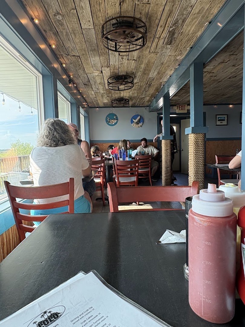 Casual dining space near the water.